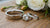 Does Wedding Band Go In Front Or Behind Engagement Ring?