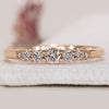 Yellow gold wedding band with 7 round diamonds.
