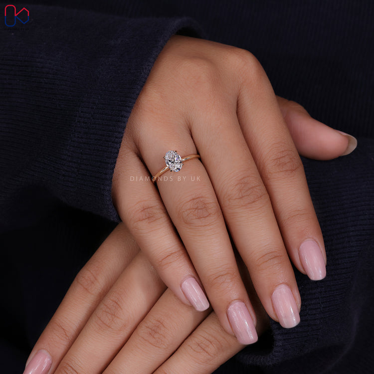 Lab Grown Diamond featured in an oval shaped engagement ring for eco-friendly elegance.
