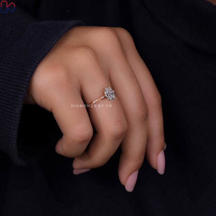 Handmade ring featuring an oval shaped engagement ring and 4 prong claw setting.
