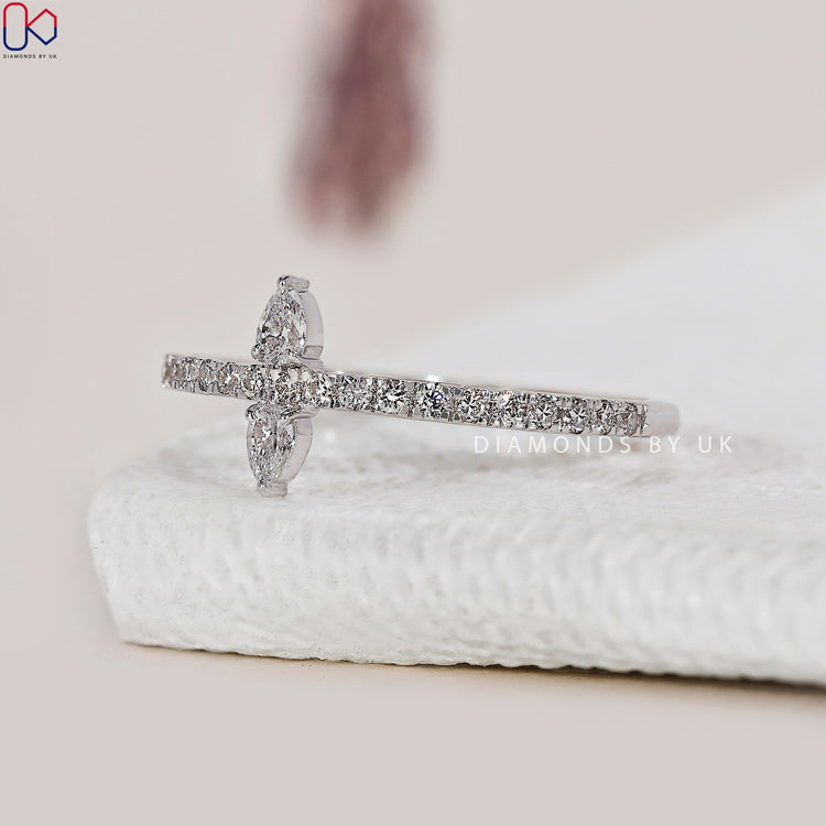 Prong set band with round cut diamonds.
