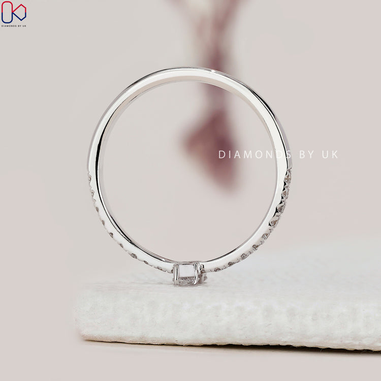 Handmade band with prong set round cut diamonds.
