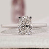 Oval solitaire engagement ring with cathedral setting ring.
