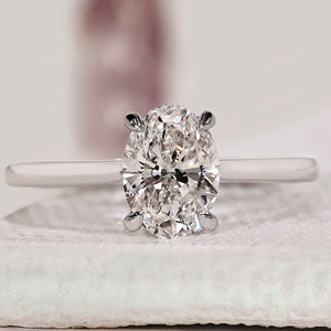Oval Solitaire Engagement Ring With Cathedral Setting