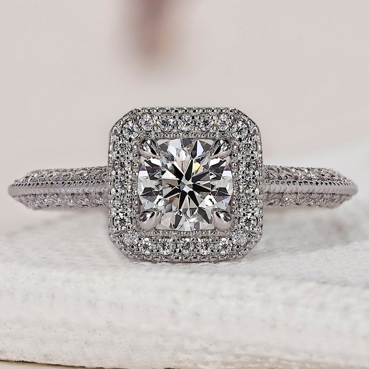 Round halo engagement ring with a stunning diamond centerpiece.
