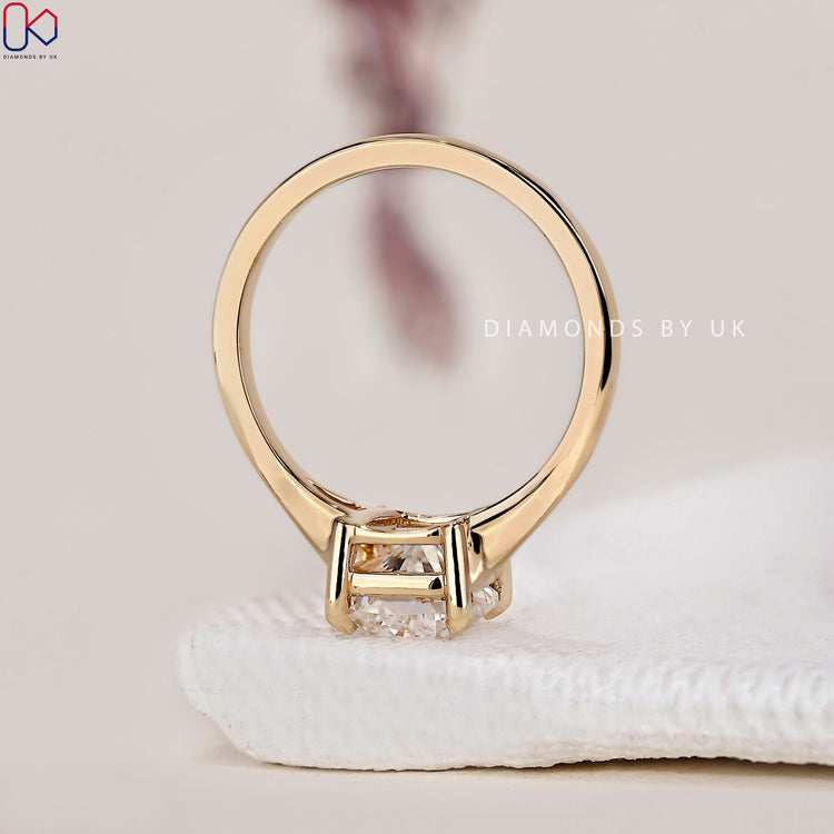 Split shank ring featuring an elegant elongated cushion cut diamond.
