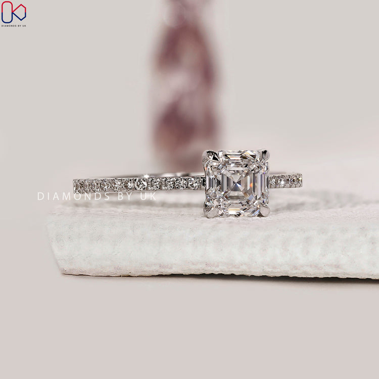 Custom engagement ring with Asscher and round diamonds.