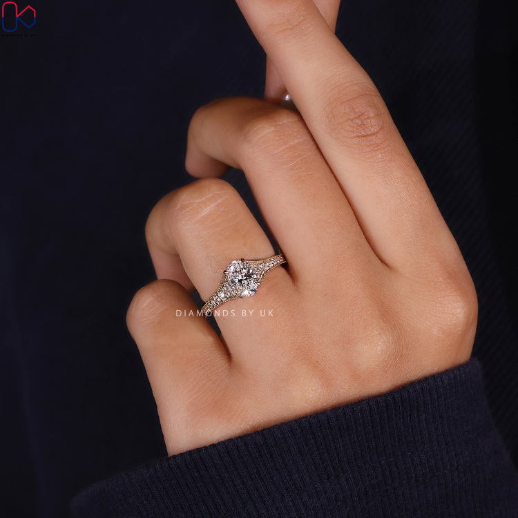 Tapered pave setting ring with milgrain detailing.
