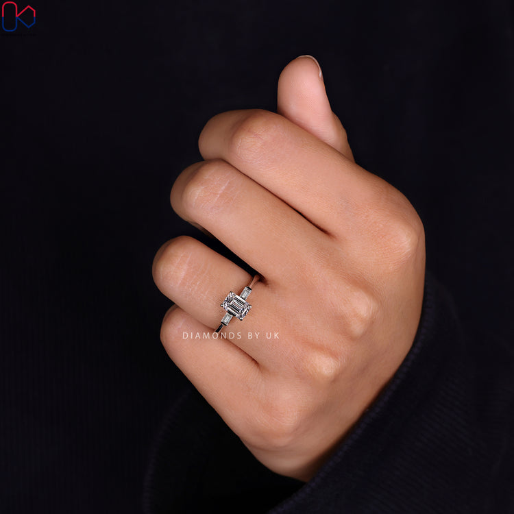 Emerald and baguette cut diamond ring set in a beautiful white gold ring.
