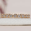 Yellow gold wedding band with a round diamond band for a classic look.
