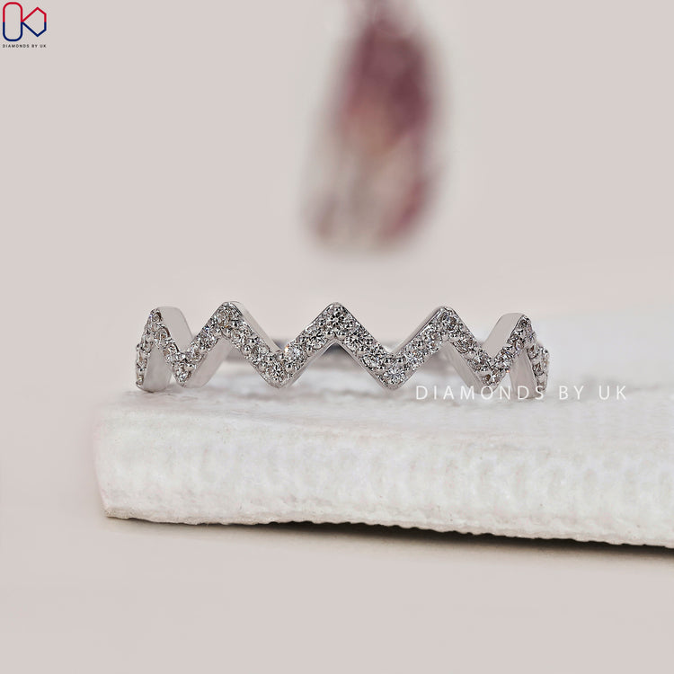 Diamondsbyuk wedding band with handmade detail and lab diamonds.
