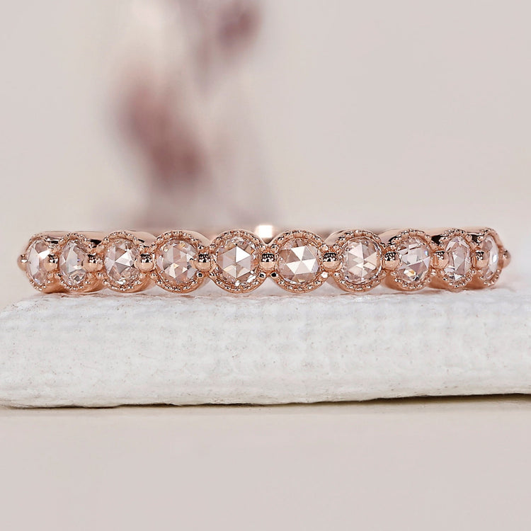 Rose gold eternity band with a stunning round diamond band design.

