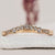 curved wedding band styled with yellow gold design
