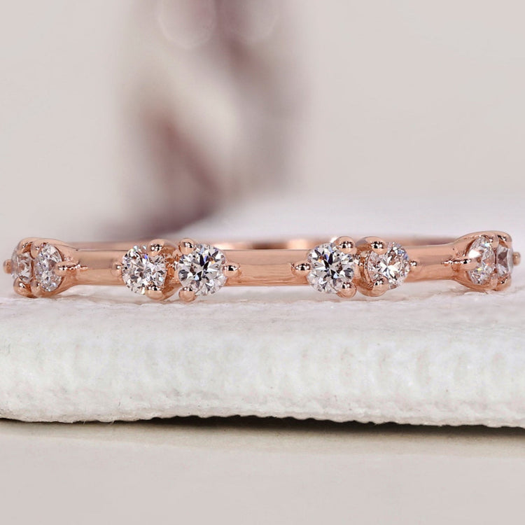 Round diamond wedding band set in a beautiful rose gold wedding band design.

