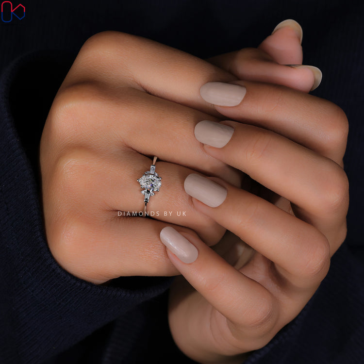 White gold diamond ring featuring a beautiful tear drop centre stone.