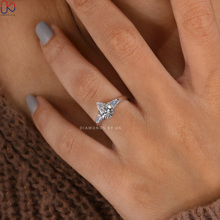 Diamondsbyuk engagement ring with 3 stone pear shaped design.
