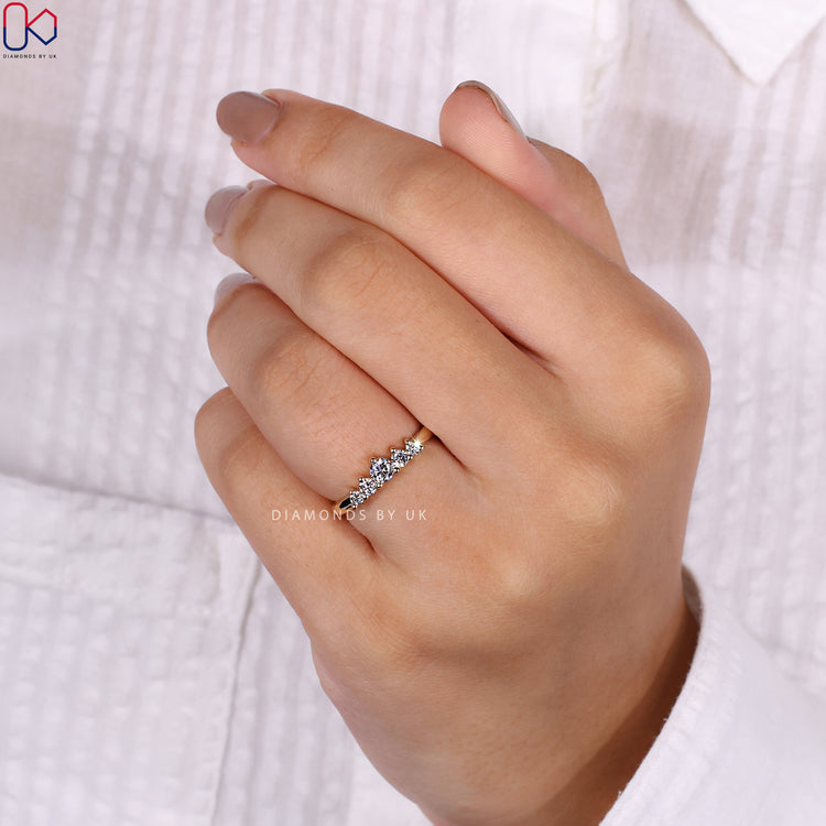 Round diamond wedding band featuring sparkling diamonds for a classic look.