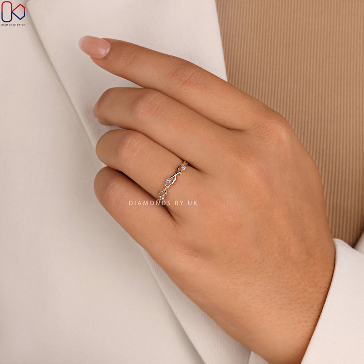 A nature inspired wedding band showcasing delicate details and unique craftsmanship.
