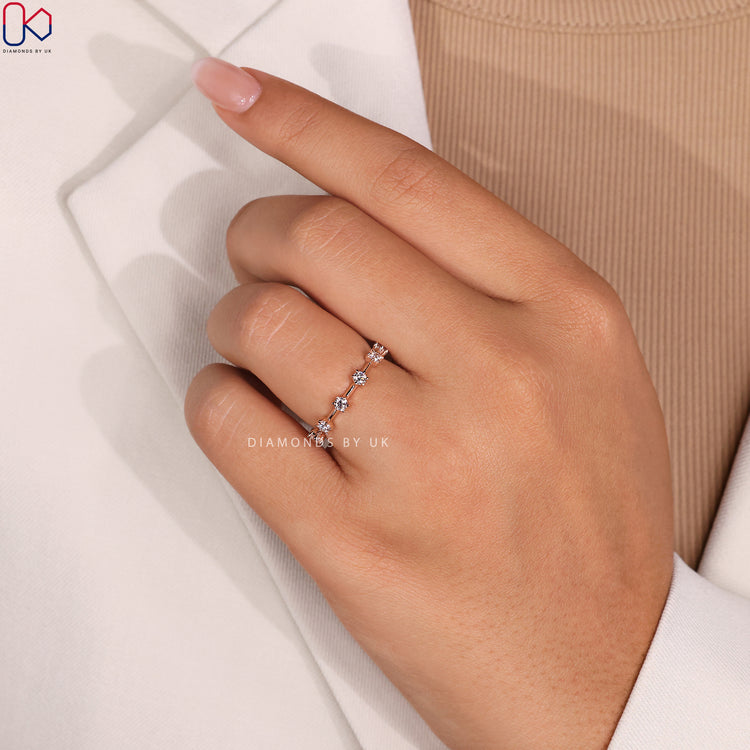 Handmade jewelry featuring an eternity band with brilliant diamonds.
