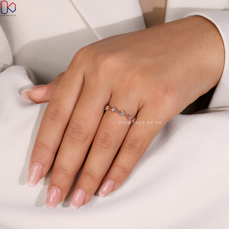 Diamondsbyuk wedding band with round diamonds for a timeless style.
