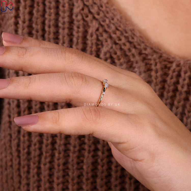Handmade jewellery showcasing yellow gold diamond band with prong setting.