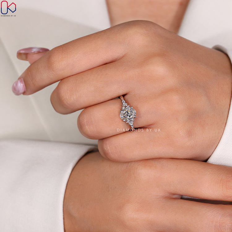 Stunning oval ring with marquise side stones.
