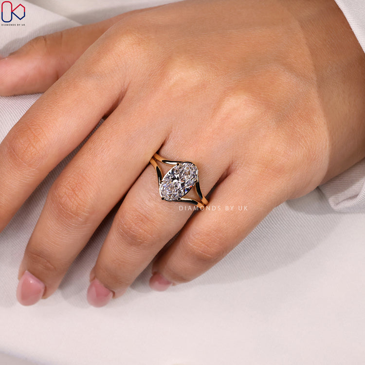 Handmade ring with oval cut diamond and split band.

