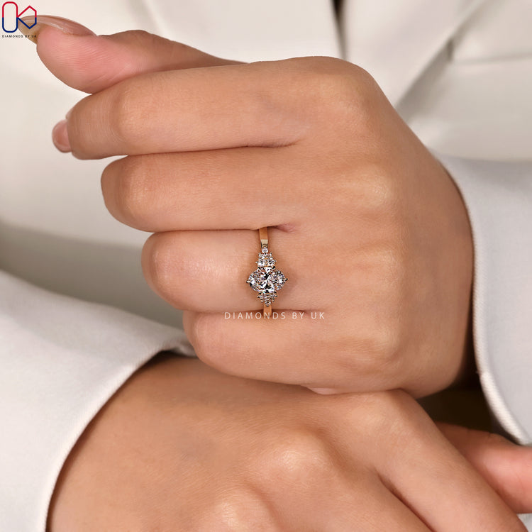 Round side stone ring with oval shaped center.
