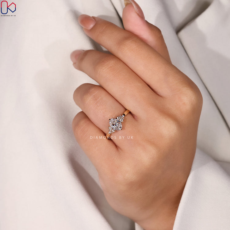 Handmade ring with oval shape and round side diamonds.
