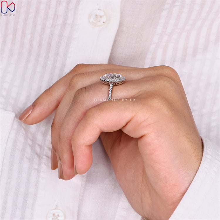 Classic white gold ring with a halo setting.
