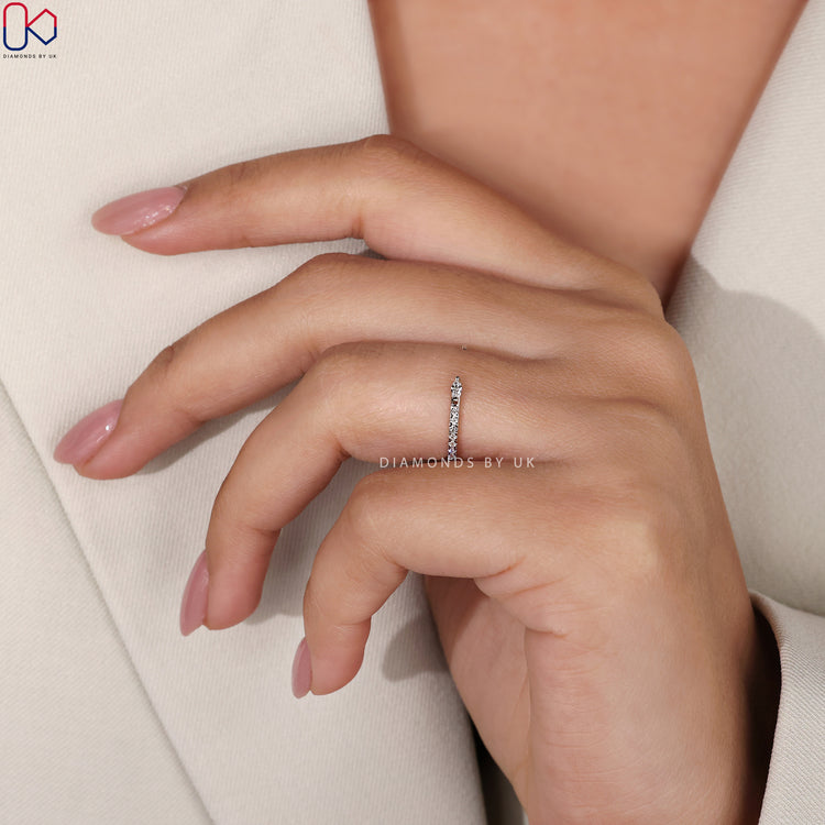 Open gap wedding band with diamonds for a modern, unique look.
