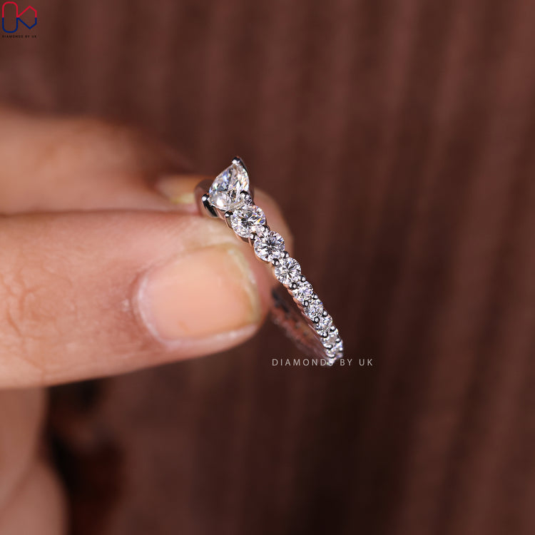 Prong set wedding band that highlights each diamond.
