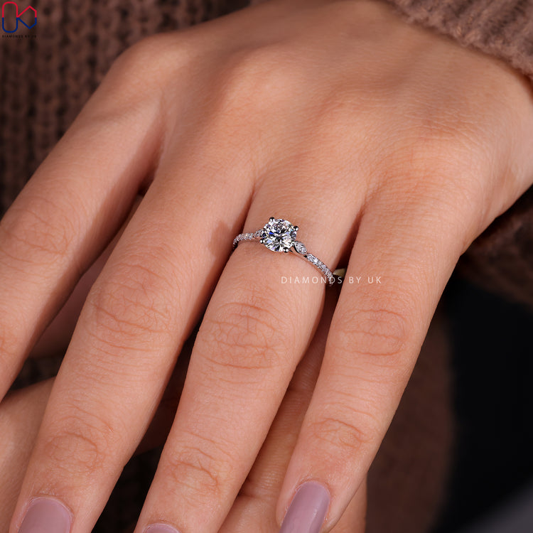 Elegant cathedral setting ring showcasing sparkling diamonds.
