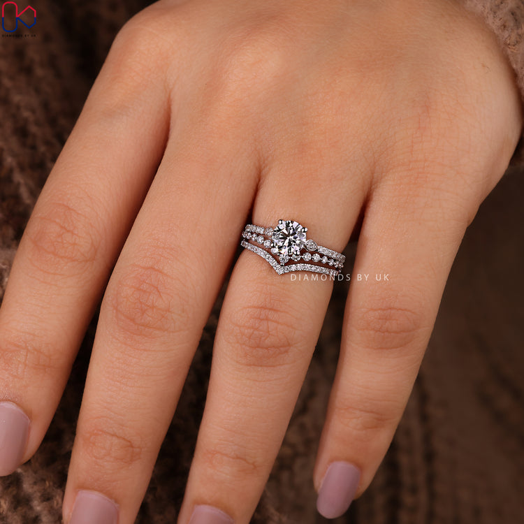 White gold diamond bridal set featuring prong setting ring and wedding band.
