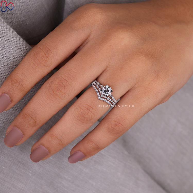 Double row wedding band paired with pave engagement ring in white gold.
