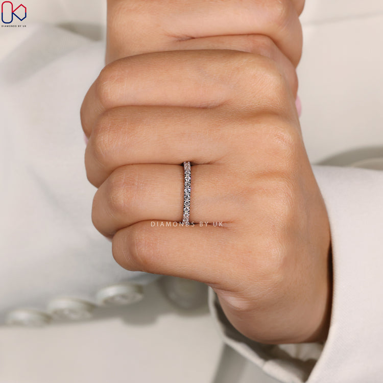 Pave wedding band, featuring diamonds set in a continuous row.
