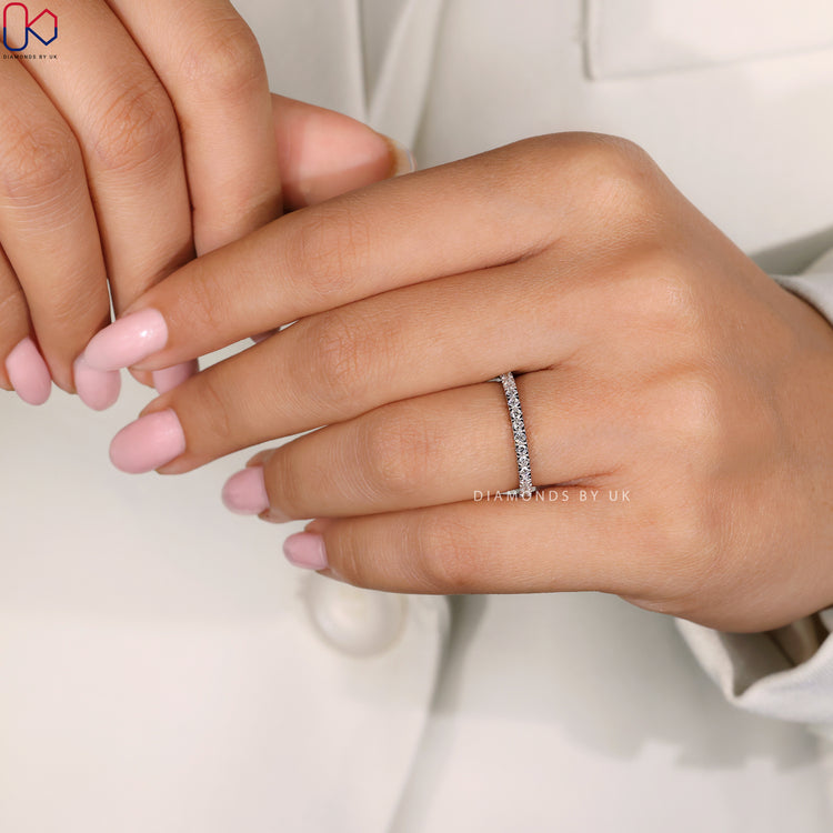 Round diamond wedding band designed for simplicity and timeless beauty.
