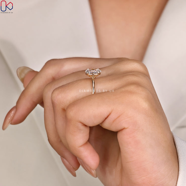 Lab grown diamond ring with oval cut center.
