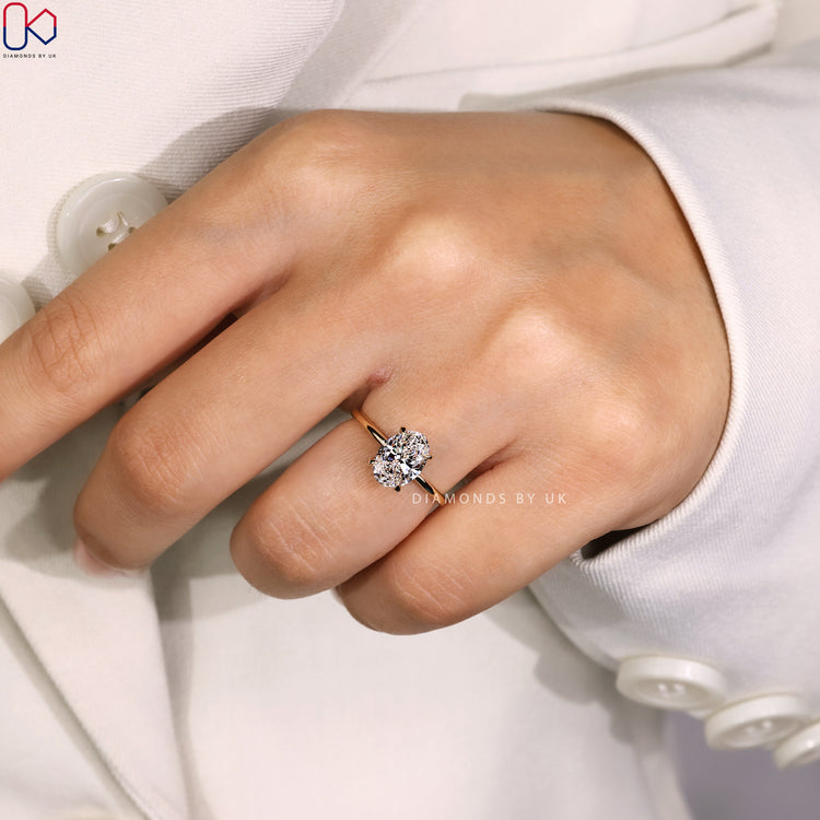 Handmade jewellery featuring oval solitaire and claw prong.
