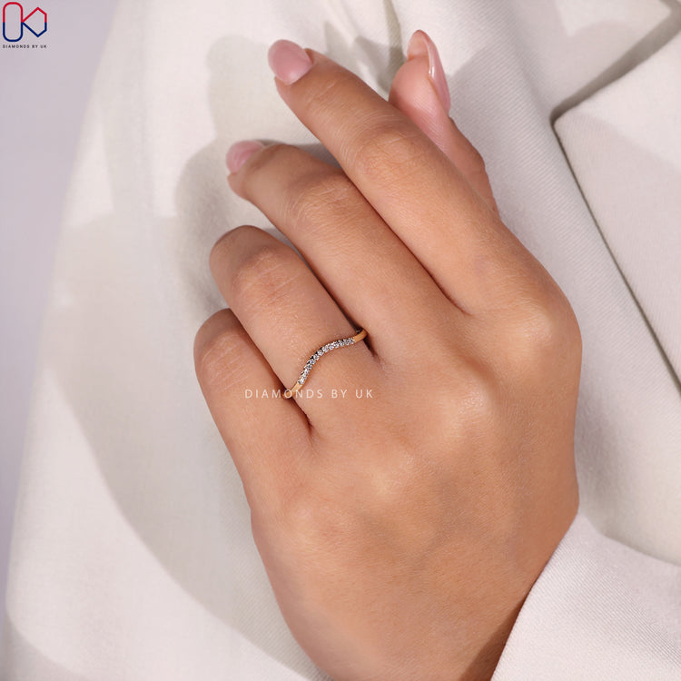 Buy wedding band featuring high-quality diamonds and a curved shape.
