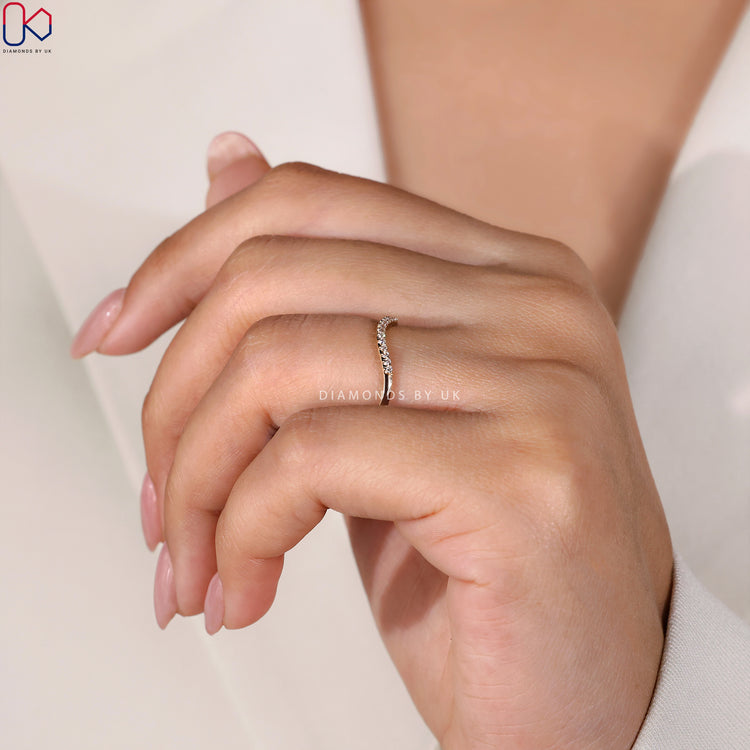 Yellow gold wedding band for women featuring sparkling diamonds.
