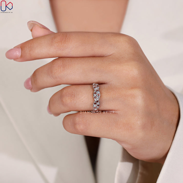 Handmade ring with a twisted design, perfect for your special day.
