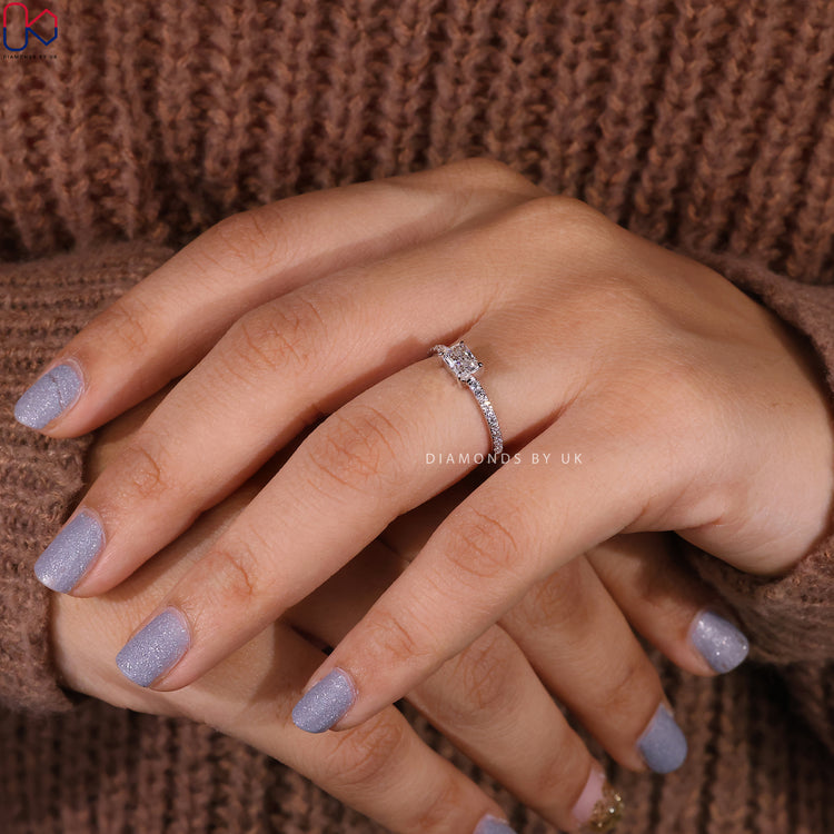 Pave diamond ring featuring a radiant cut in white gold.
