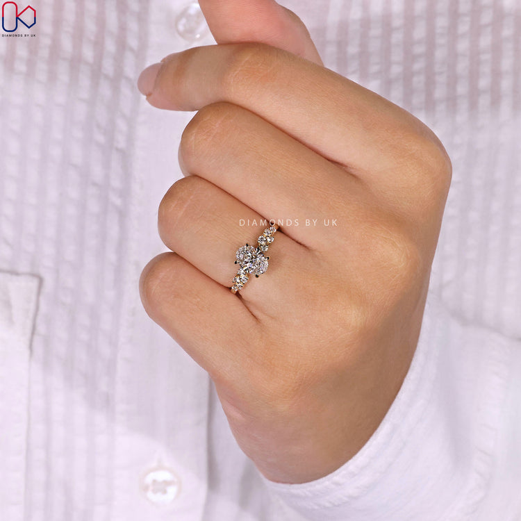 Customize ring with claw prong and side diamonds.
