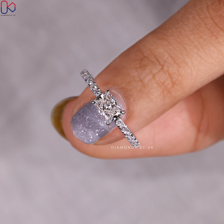 Diamondsbyuk engagement ring with radiant cut and white gold band.
