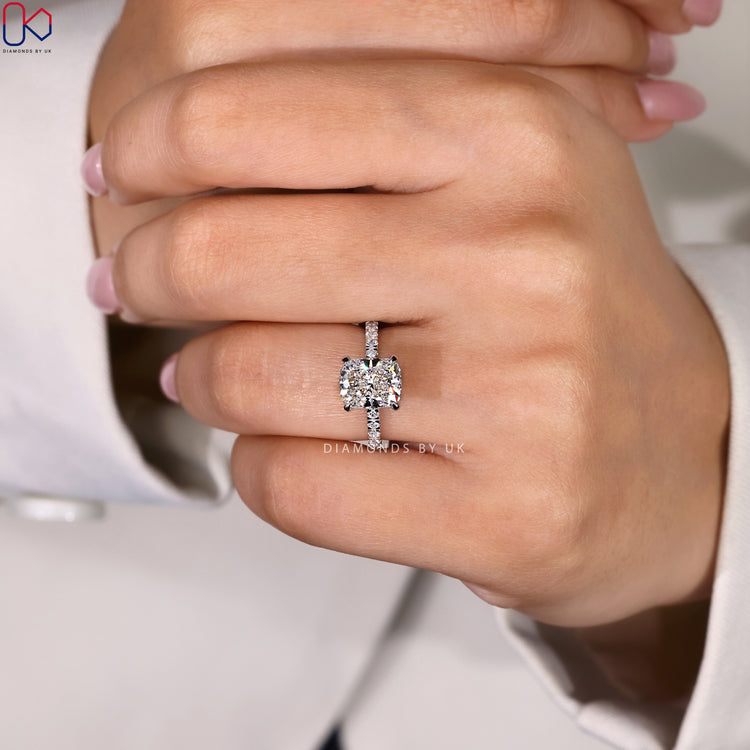 Diamond engagement ring with pave setting ring.
