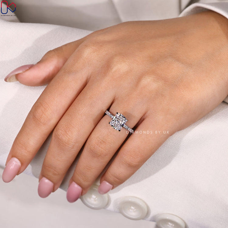 White gold engagement ring with cushion cut engagement ring.
