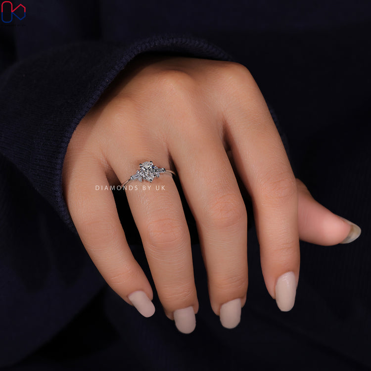 Diamondsbyuk ring featuring a tear drop diamond and stunning baguette side stones.