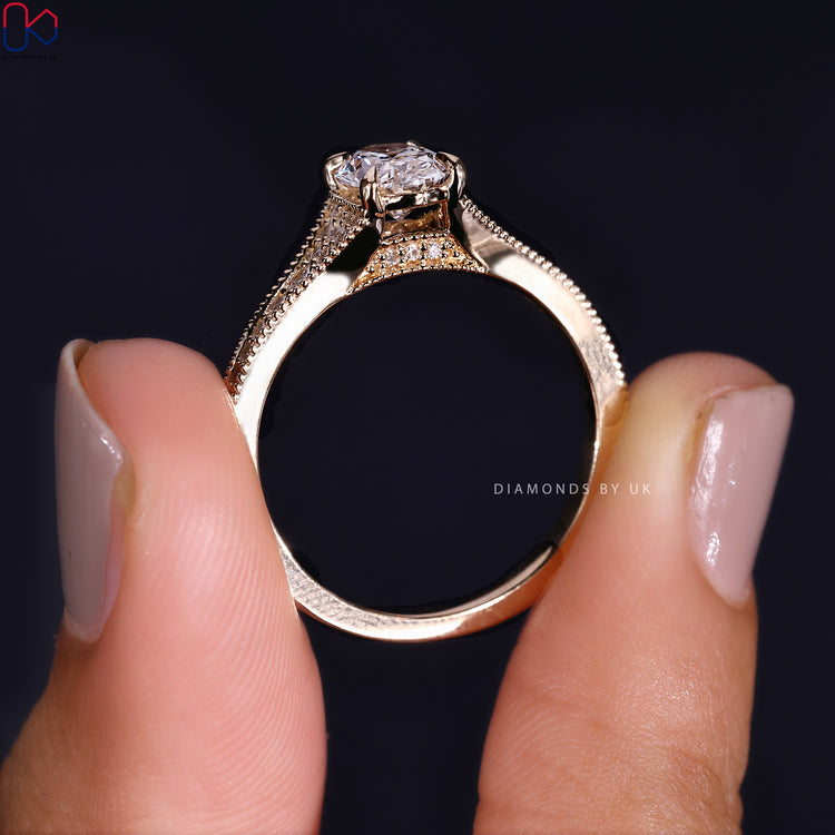 Customize ring with tapered pave and oval diamond.
