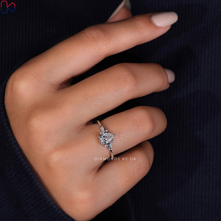 IGI certified tear drop diamond ring featuring elegant baguette side stones.